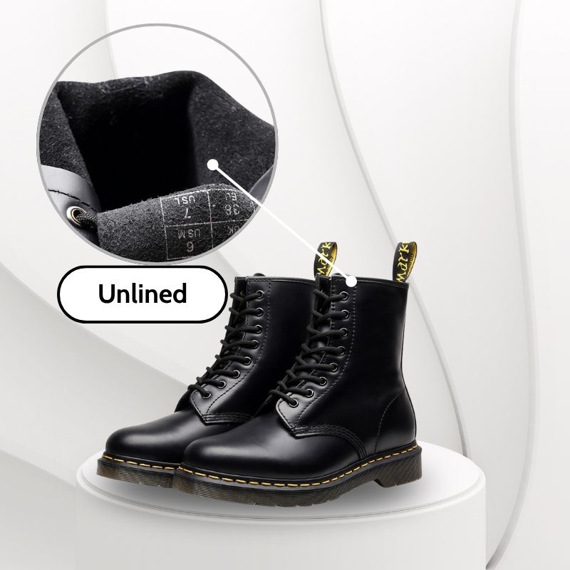 Black leather boots with laces on a white background, featuring an inset showing the insole.
