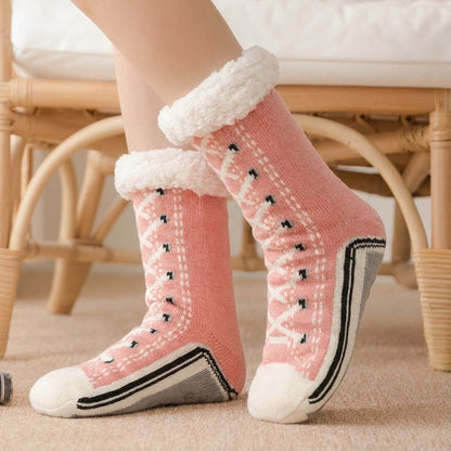 Fleece-lined sneaker-style slipper socks – pink pair worn indoors