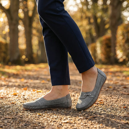 Women's grey loafers shown on foot