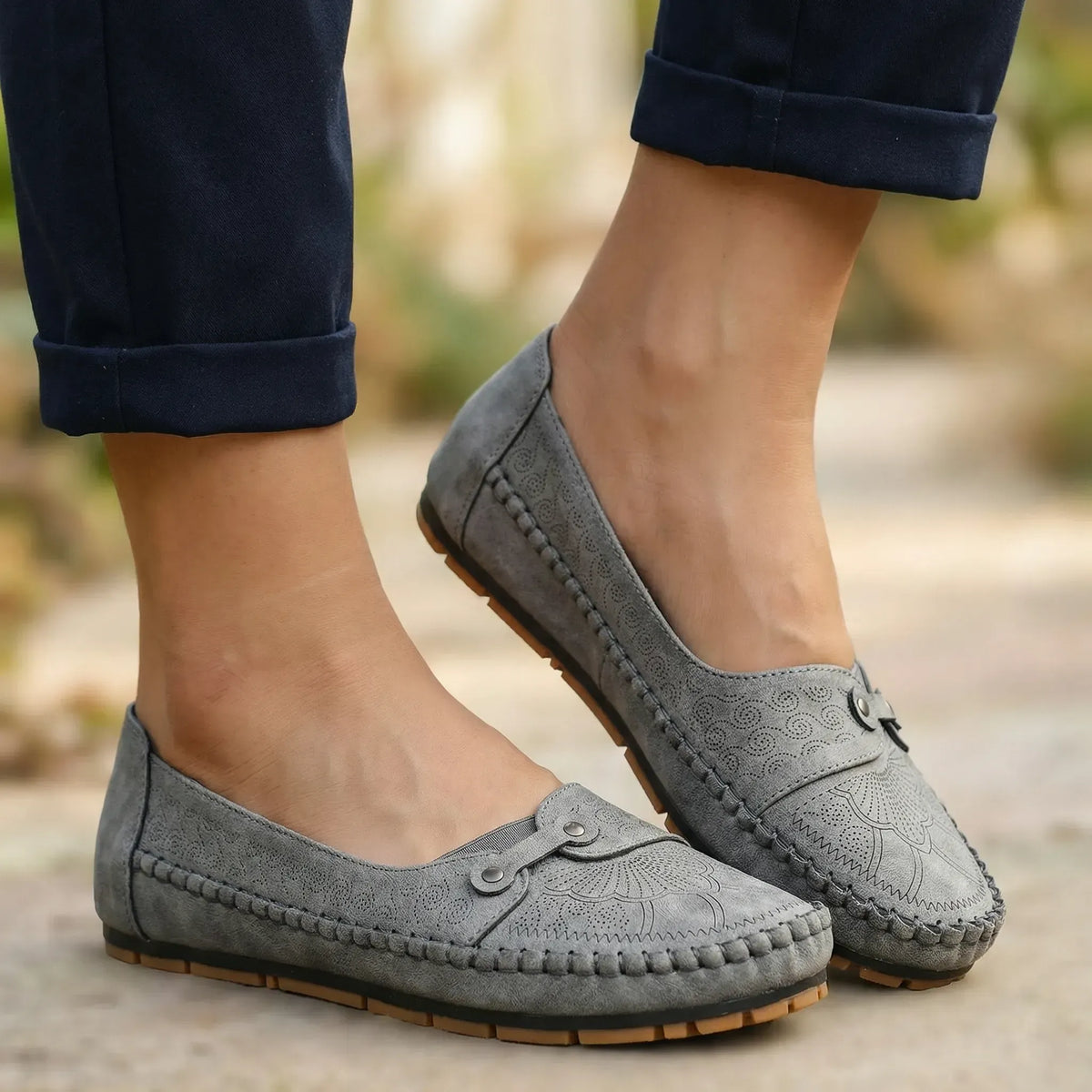 Women's grey loafers shown on foot