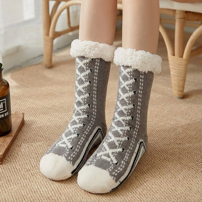 Fleece-lined sneaker-style slipper socks – grey pair on a rug