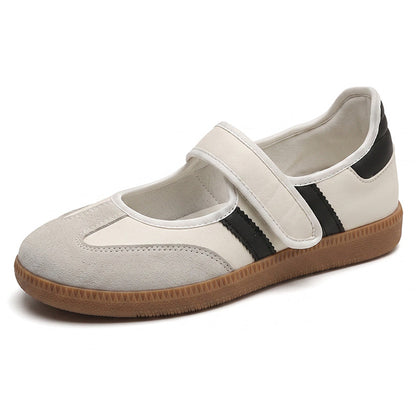 Cream women's suede Mary Jane trainers with black side stripes, a strap and gum sole