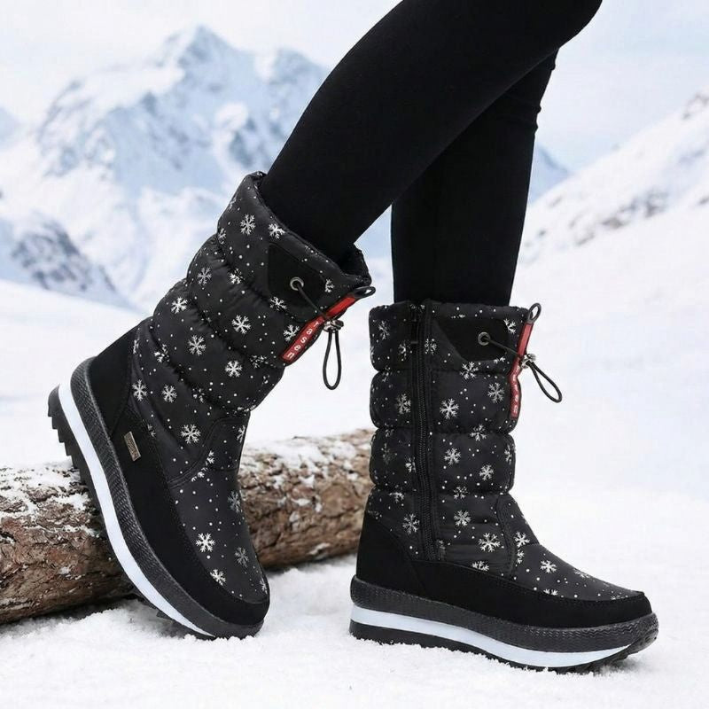 Auldweave women's waterproof mid-calf snow boots – black snowflake boots worn in a mountain setting