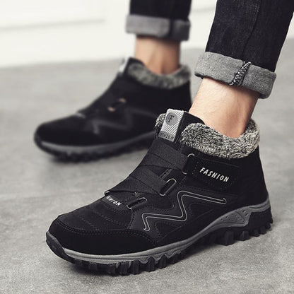 Black and white winter boots with fleece collars worn outdoors