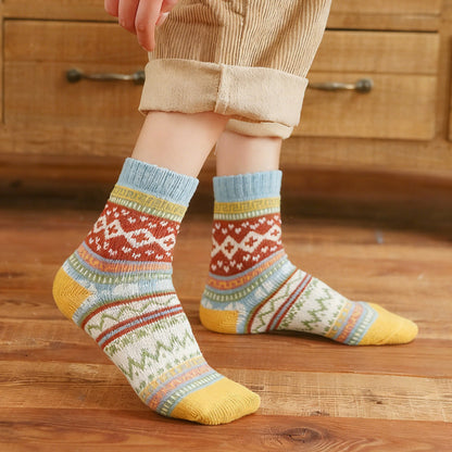 Five-pair Nordic-pattern winter socks – colourful patterned pair worn indoors