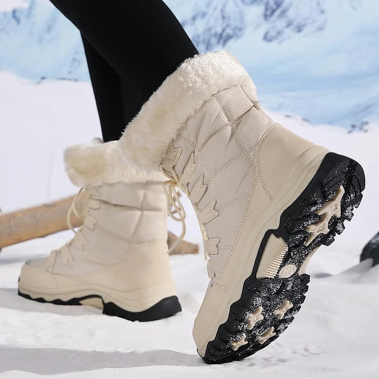Beige winter boots showing the side profile and textured outsole