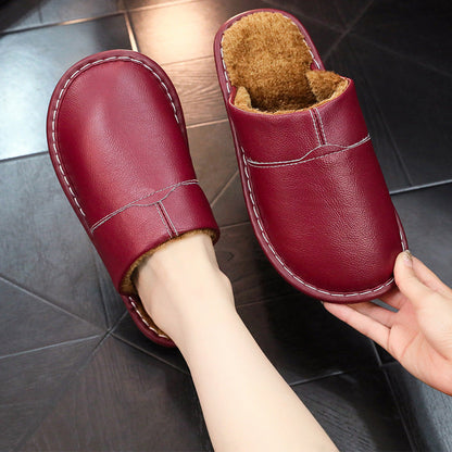 Auldweave warm wide fit leather slippers – burgundy slipper worn with matching pair held