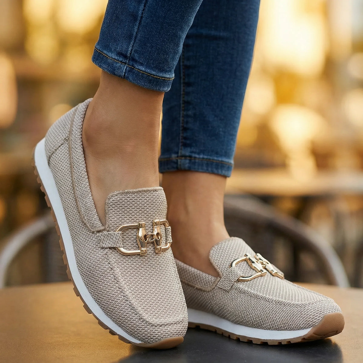 Women's khaki loafers shown on foot