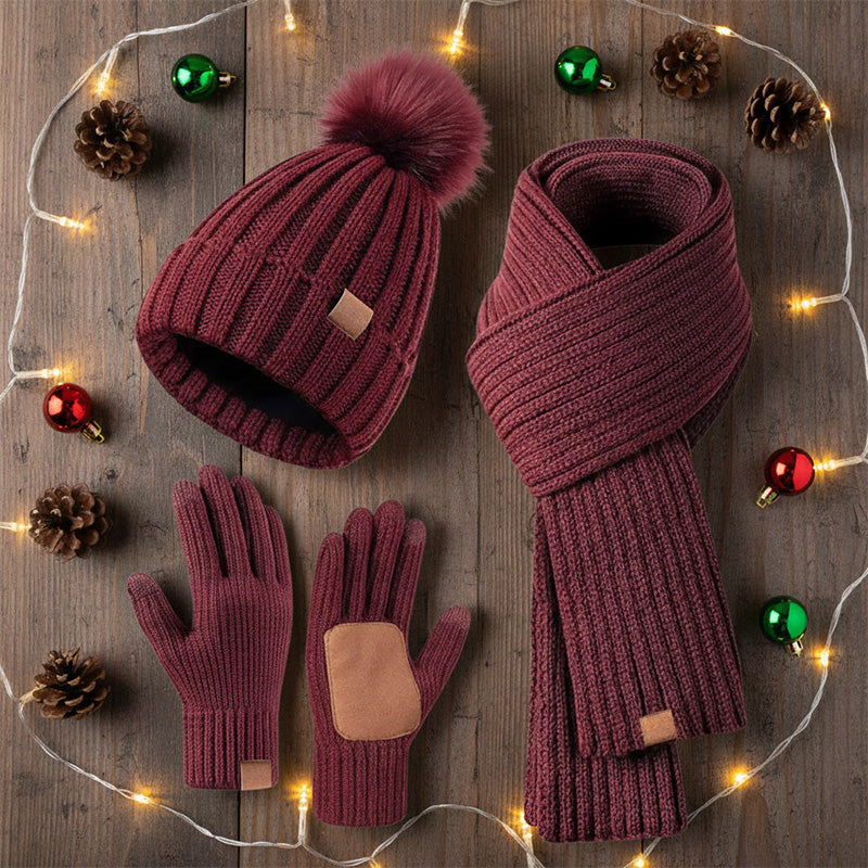 Winter hat scarf and glove set – burgundy set beside festive lights