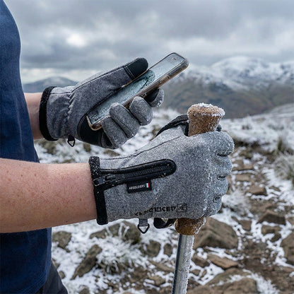 Winter touchscreen gloves – grey gloves used with a phone outdoors
