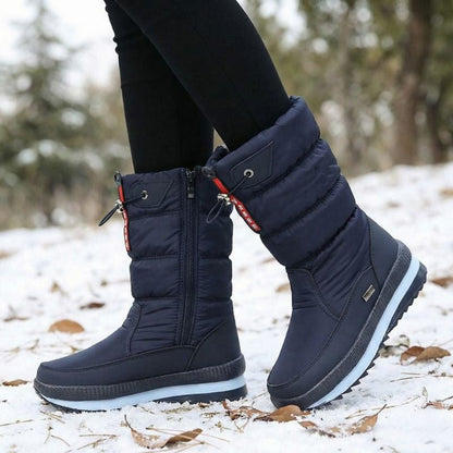 Auldweave women's waterproof mid-calf snow boots – navy boots worn from the side in snow
