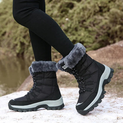 Side view of black fleece-lined winter boots worn outdoors