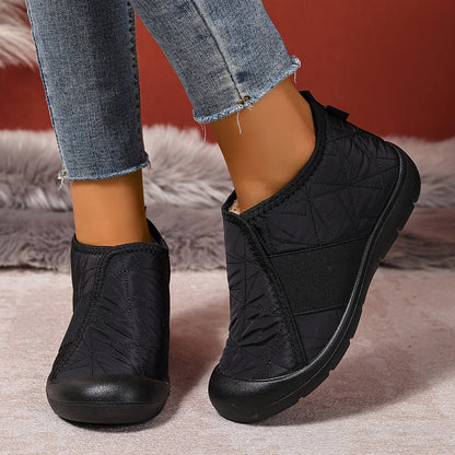 Fleece-lined slip-on ankle boots – black pair worn with jeans