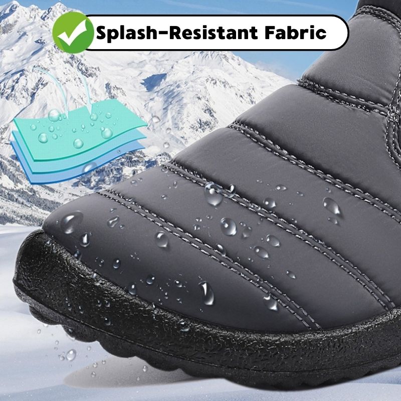 Close-up of water droplets on a black winter boot upper