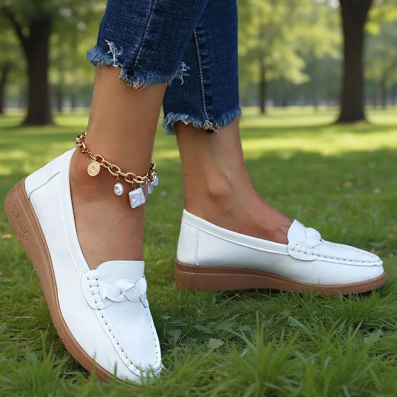 White wide fit loafers for women, side on-foot park view