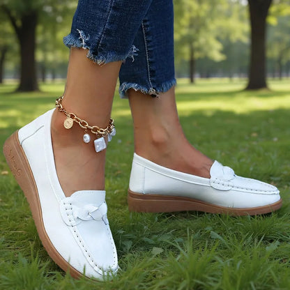 White wide fit loafers for women, side on-foot park view