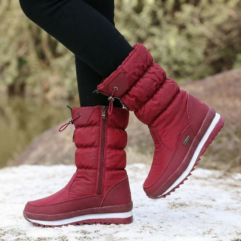 Auldweave women's waterproof mid-calf snow boots – burgundy boots worn from the side in snow