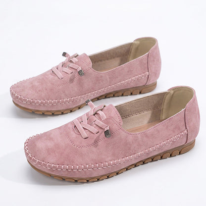 Pink women's wide fit suede loafers with decorative lacing and stitched edges, product pair