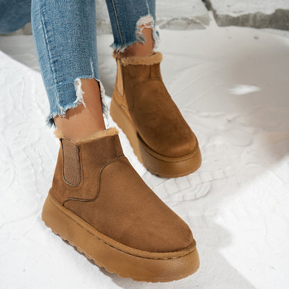 Plush-lined platform ankle boots – tan pair worn outdoors