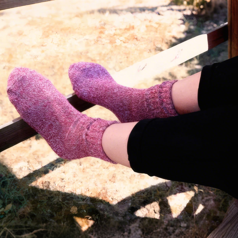 Five-pair thermal wool-blend socks – pink pair worn by a fireplace
