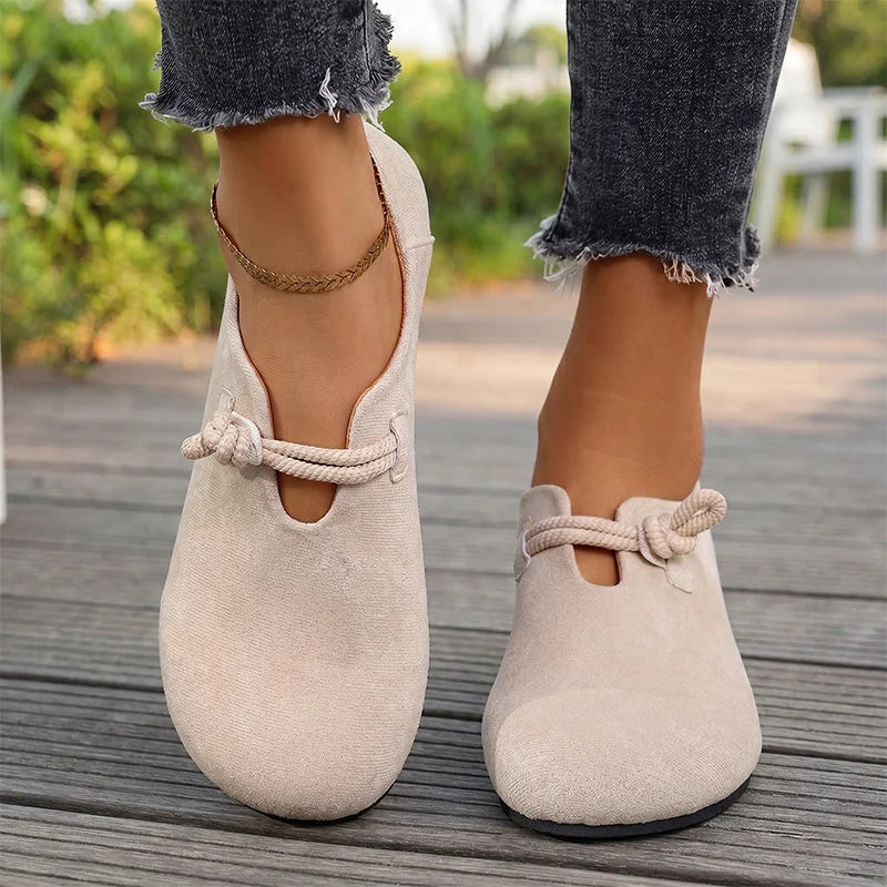 Beige comfort flats with bow detail, front on-foot view