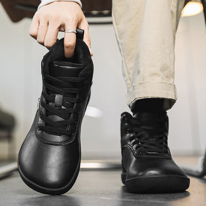 Fleece-lined lace-up winter boots – black pair being put on