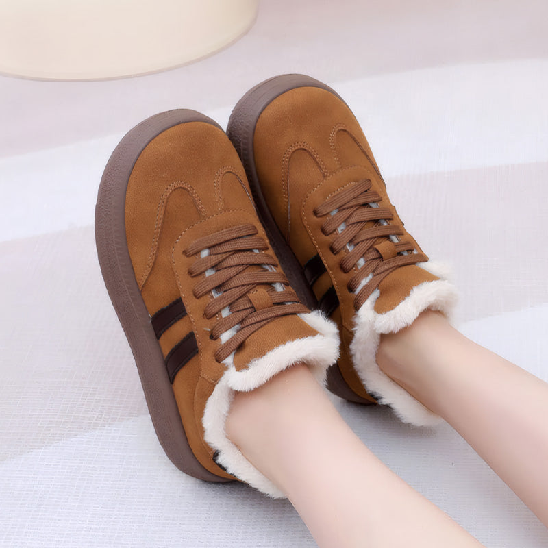 Auldweave women's fleece-lined suede trainers – tan trainers worn in a seated view