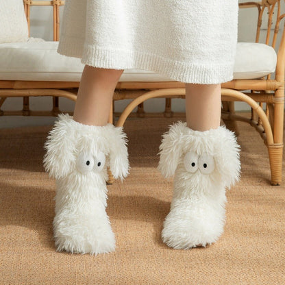 Fluffy dog slipper socks – white pair on a rug