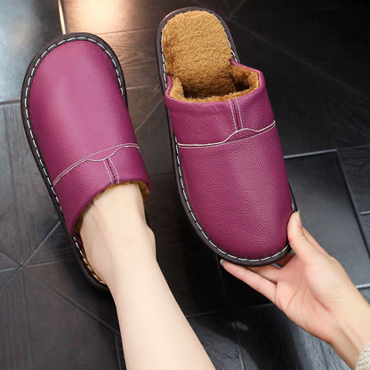 Auldweave warm wide fit leather slippers – purple slipper worn with matching pair held
