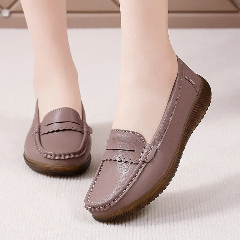Brown bow-detail loafers for women, close on-foot studio view