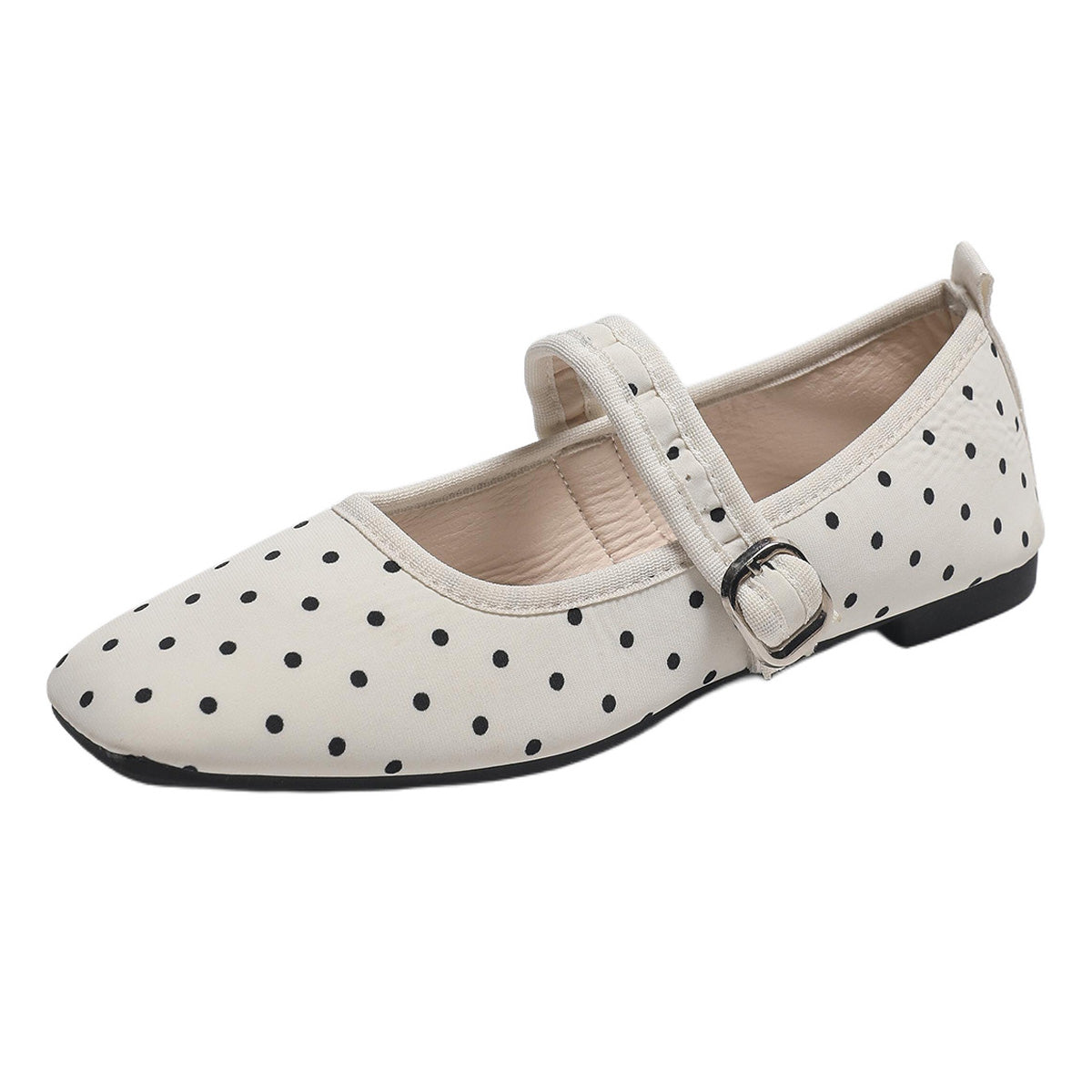 Cream women's Mary Jane flat with black polka dots and an adjustable buckle strap