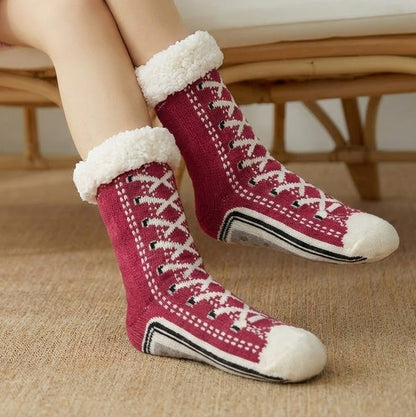 Fleece-lined sneaker-style slipper socks – burgundy pair worn indoors