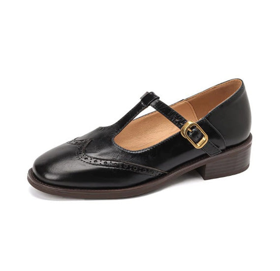 Black women's wide fit Mary Jane brogue flat with T-bar buckle strap, side view