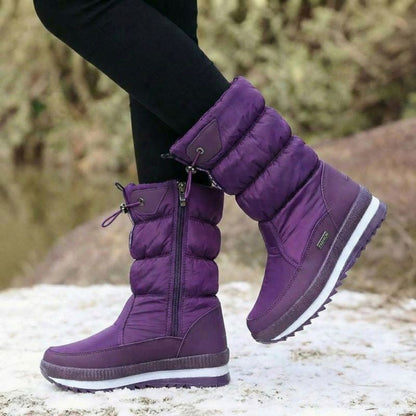 Auldweave women's waterproof mid-calf snow boots – purple boots worn from the side in snow