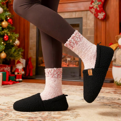 Auldweave women's warm shearling slippers – black slippers worn by a fireplace
