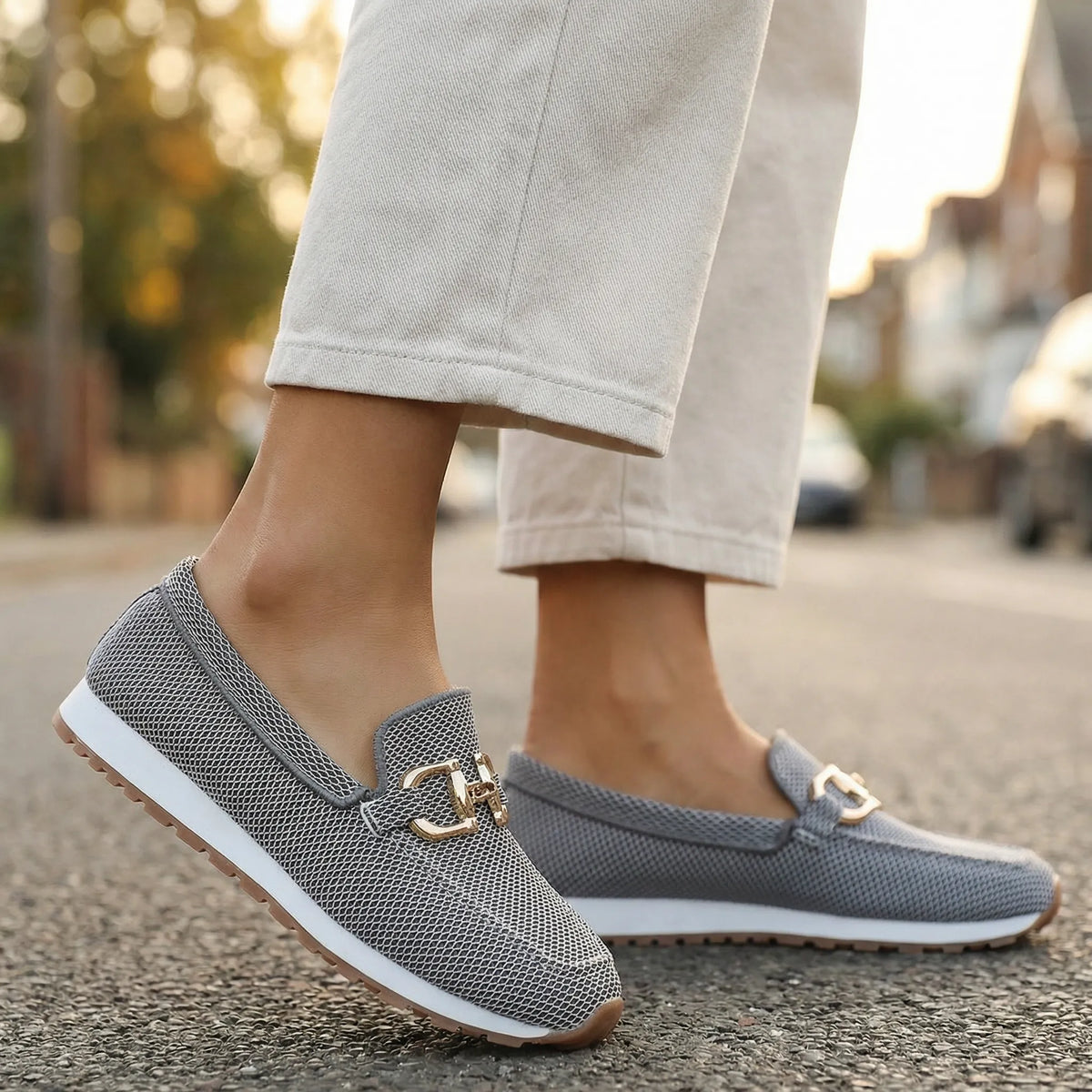 Women's grey loafers shown on foot