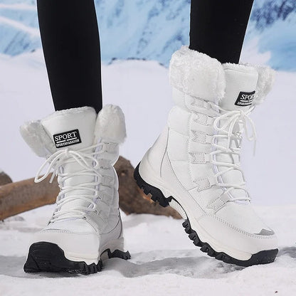 White lace-up winter boots with white fleece cuffs worn in snow