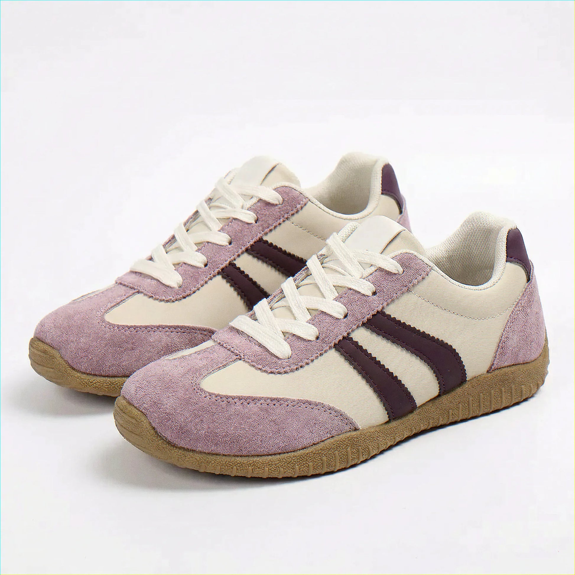 Women's wide fit trainers in lavender purple, angled studio pair
