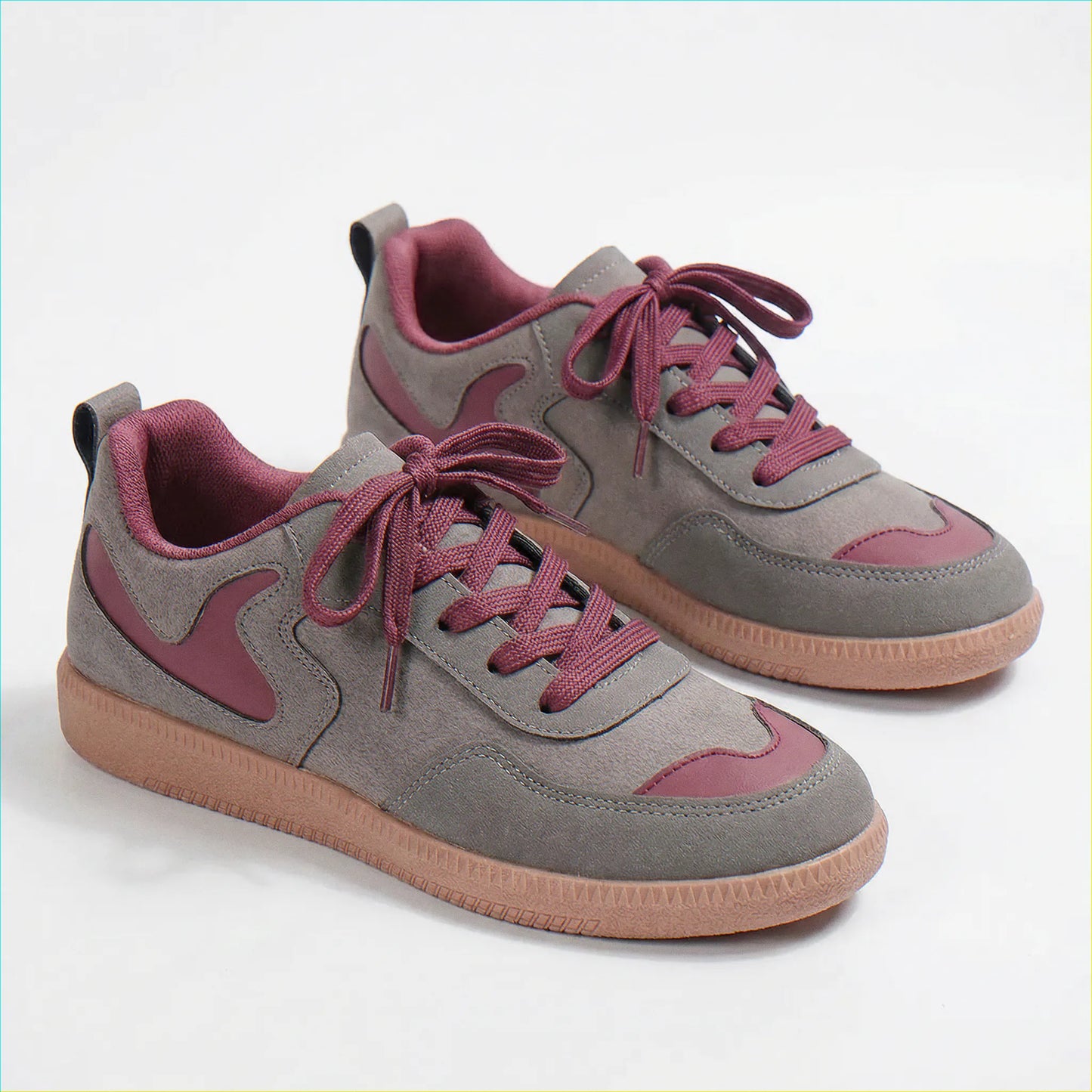 Grey and pink retro trainers for women, front studio pair