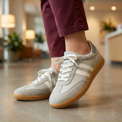 Cream and navy trainers for women, indoor on-foot lifestyle view