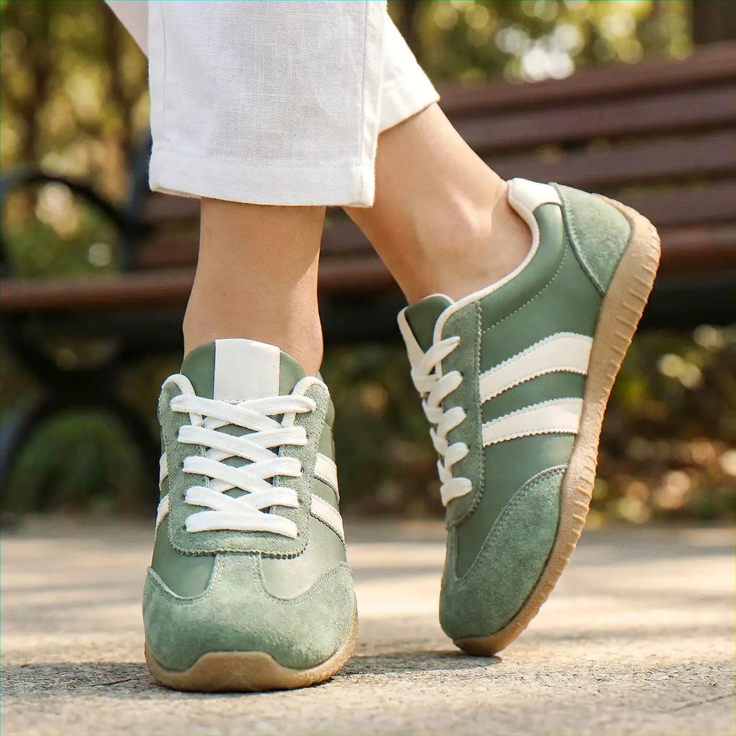 Olive green trainers for women, close on-foot park view