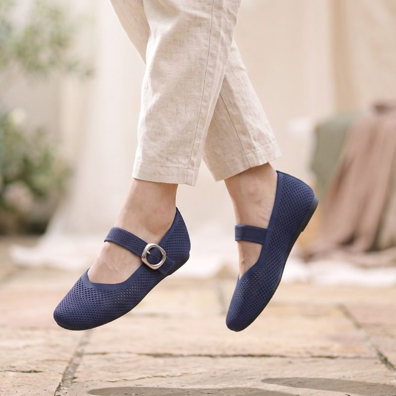 Navy wide fit Mary Jane flat shoes with square toe and adjustable strap worn outdoors
