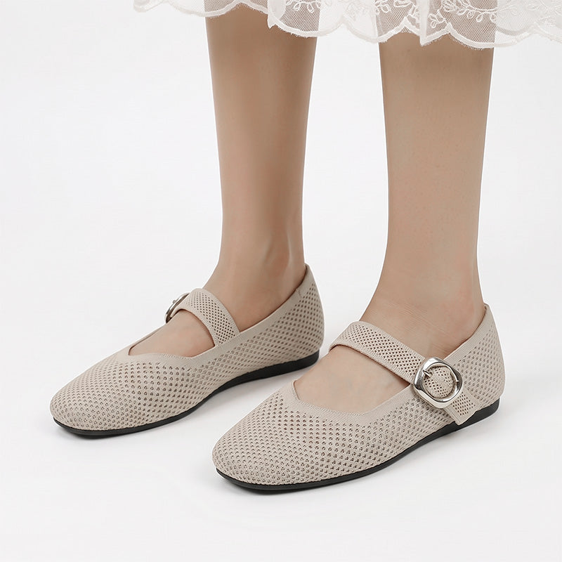 Beige women's Mary Jane flats with breathable knit upper worn from the front