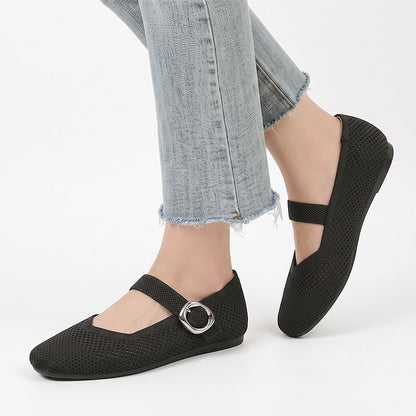 Black wide fit Mary Jane flat shoes with buckle straps worn with jeans