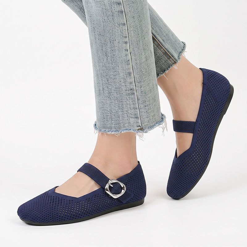 Navy Mary Jane flat shoes with buckle straps worn with jeans