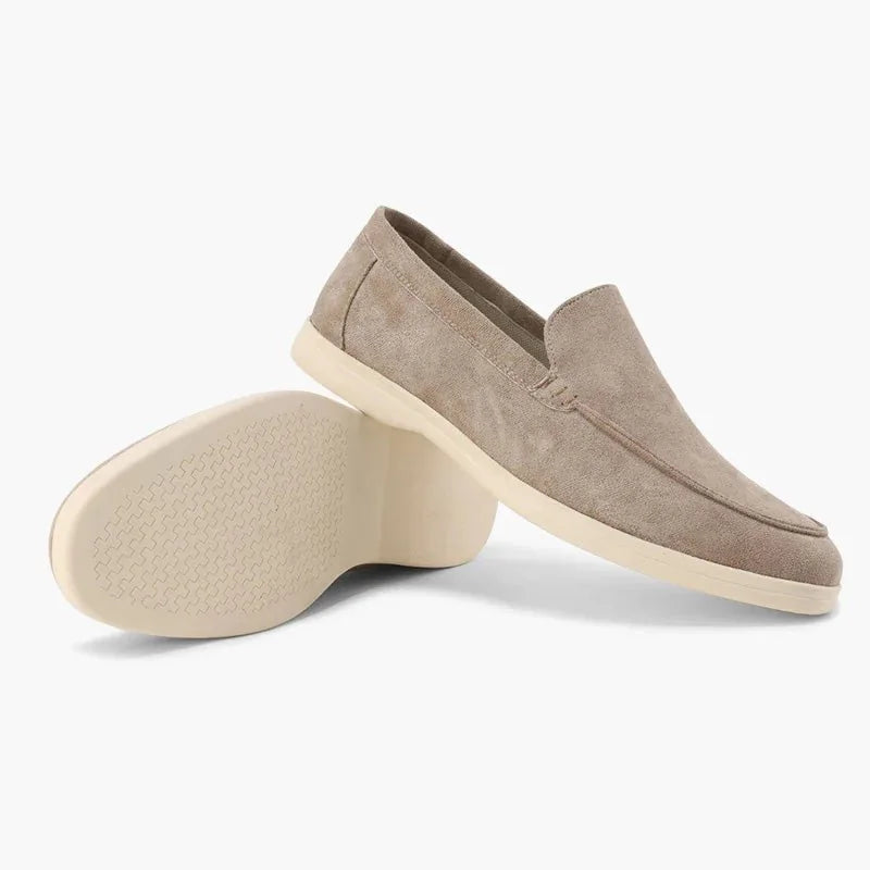 Beige men's loafers shown from the side with outsole view
