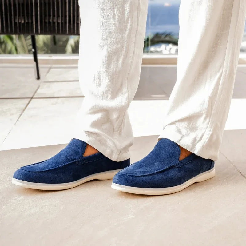 Marine blue men's loafers worn indoors, front view