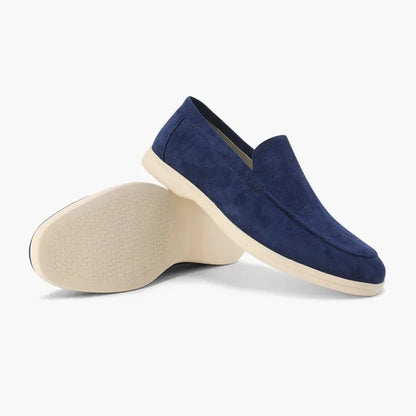 Marine blue men's loafers shown from the side with outsole view