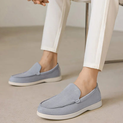 Fog blue men's slip on loafers worn with white trousers