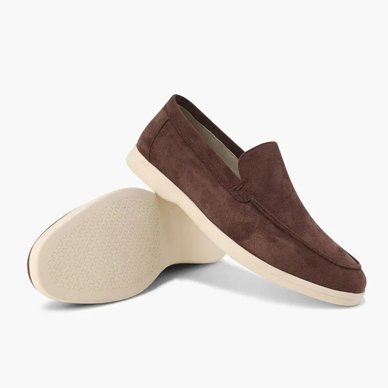 Chocolate brown men's loafers shown from the side with outsole view
